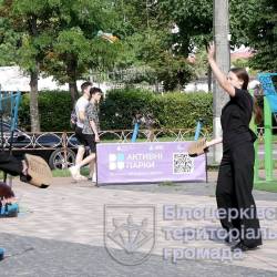 головна